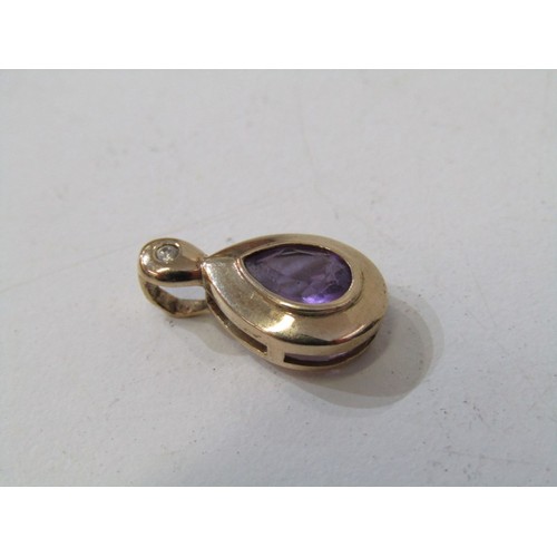 52 - GOLD FRAMED PENDANTS, 2x 9ct gold stone set pendants, 1 set amethyst, other red stone 1.9 grams