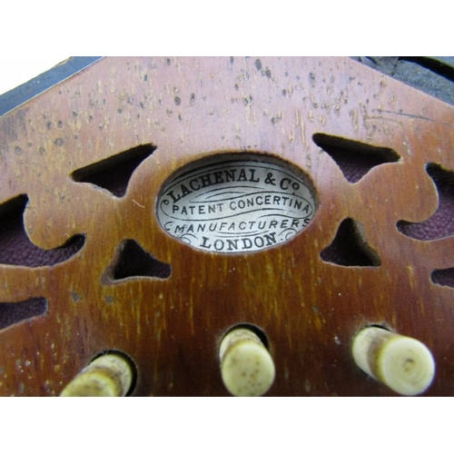 43 - LACHENAL CONCERTINA, a Lachenal & Co 21 button concertina with decorative fretwork end panels, circa... 