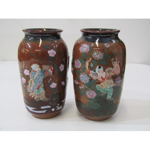11 - ORIENTAL VASES, a pair of Japanese pottery vases with hand painted figures in relief on a floral and... 