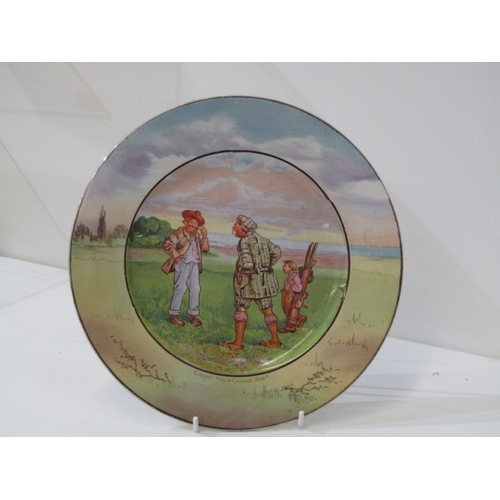 27 - GOLFING, a pottery plate c.1900 depicting a comical   golfing scene, titled 'Carry your Caddy, Sir?'... 