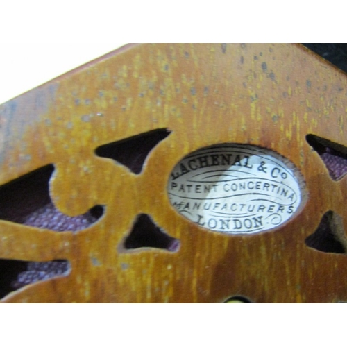 43 - LACHENAL CONCERTINA, a Lachenal & Co 21 button concertina with decorative fretwork end panels, circa... 