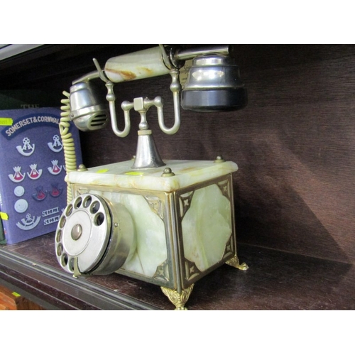 51 - ROTARY DIAL TELEPHONE, an antique style onyx and brass rotary dial telephone, 25cm height