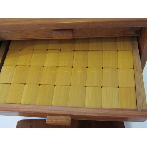 53 - MAH JONG SET, a vintage mah jong set, pieces and strips contained in 5 wooden drawers, in a wood and... 