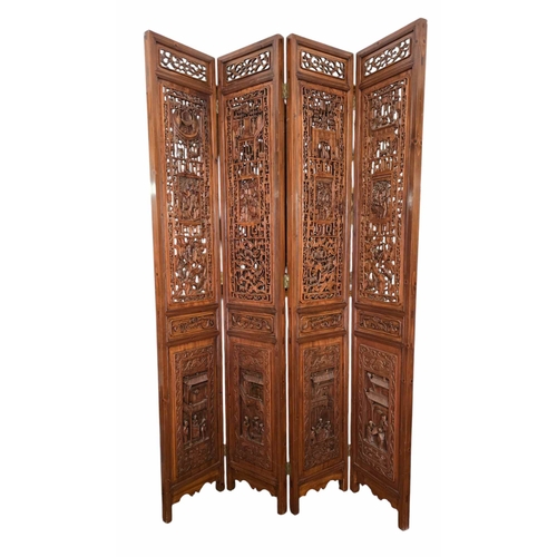 A Chinese Four-Fold Hardwood Screen, Deeply Carved with Figural and Auspicious Motifs. 
A finely carved Chinese four-fold hardwood screen, each tall panel richly decorated in relief and openwork. The upper sections with pierced latticework incorporating shou–style key-fret borders, scholar’s table objects, vases, censers, and symbolic animals. The central panels feature deeply carved narrative scenes of scholars and attendants within pavilions, backed by open lattice grounds. The lower registers carved in high relief with further architectural scenes.
Throughout the panels, clusters of squirrels among grape vines are finely modelled, symbolising abundance, prosperity, and many descendants. Carved with exceptional detail and depth, typical of southern Chinese workshop production of the early to mid-20th century.
Mounted on brass hinges; folds flat for storage.
Height 2 meters 56cm 
Panel 43cm 
Full length 172 cm