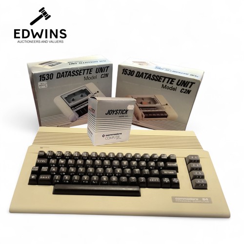 A Commodore 64 Personal Computer; Two boxed Commodore Computer 1530 Datassette Ubits, model C2N.