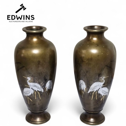 Pair of Japanese Meiji period Bronze Vase. 'Miyamoto Shoko'
Each of Ovoid form with everted rim, delicately inlaid in silver and mixed metals with herons in a waterside landscape. Signed Miyamoto to the base. Likely Miyamoto Shoko.