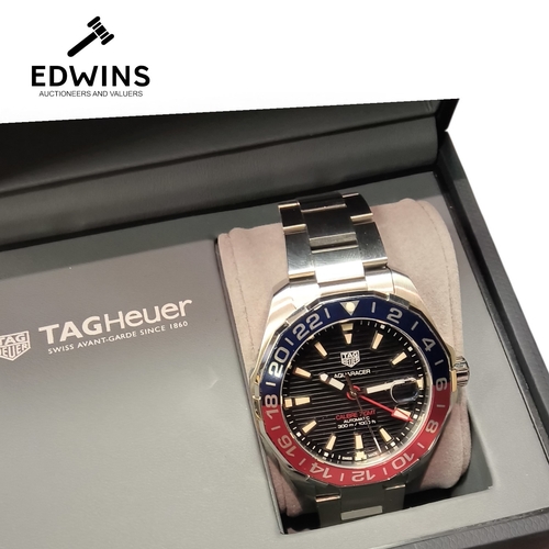 10 - A Gents Tag Heuer AQUARACER Automatic Wristwatch, 1000ft, with warranty card, guarantee card, tags, ... 