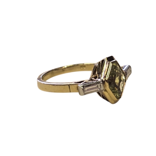 14 - An Art Deco Style 18ct Gold Green Sapphire and Diamond Ring, Set with an elongated hexagonal-cut gre... 
