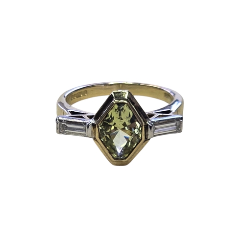 14 - An Art Deco Style 18ct Gold Green Sapphire and Diamond Ring, Set with an elongated hexagonal-cut gre... 