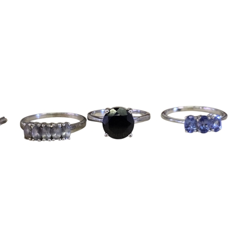 16 - A collection of 925 silver gem-set rings,
comprising a chrome diopside solitaire ring, size R½; an E... 