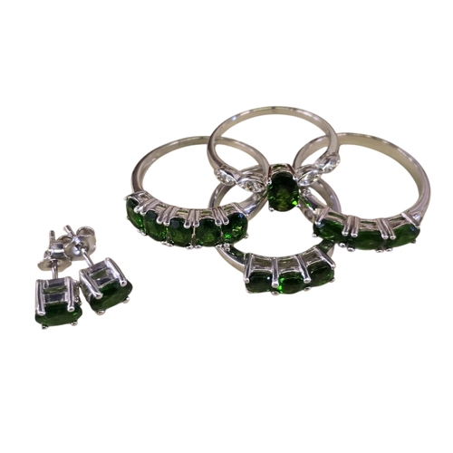 21 - A collection of sterling silver and chrome diopside jewellery, comprising a five-stone ring, size T½... 
