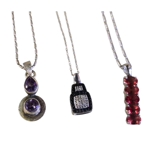 24 - A collection of six 925 silver gem-set pendant necklaces comprising a multi-gem cluster pendant set ... 