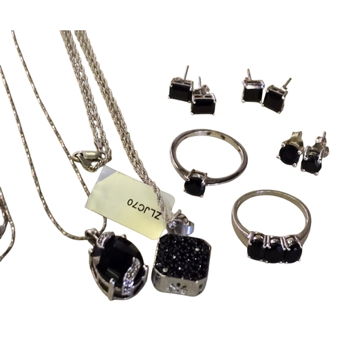 25 - A collection of 925 silver and black spinel jewellery, comprising two black spinel rings, sizes T½ a... 