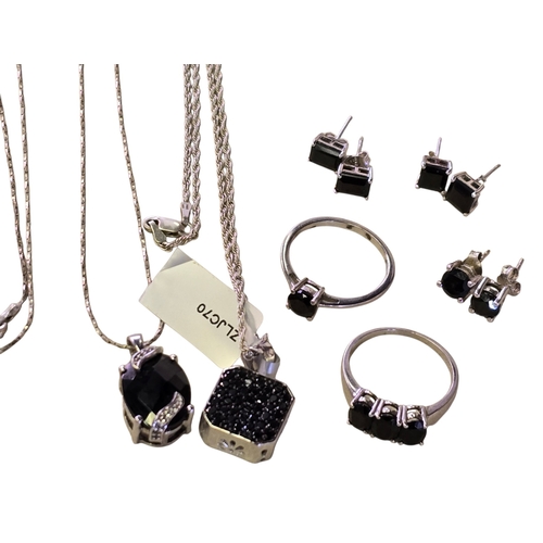 25 - A collection of 925 silver and black spinel jewellery, comprising two black spinel rings, sizes T½ a... 