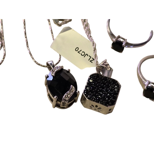 25 - A collection of 925 silver and black spinel jewellery, comprising two black spinel rings, sizes T½ a... 
