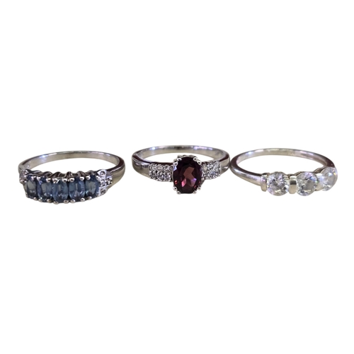 26 - A collection of 925 silver gem-set rings, comprising a floral rhodonite garnet ring, size T½; a Mong... 