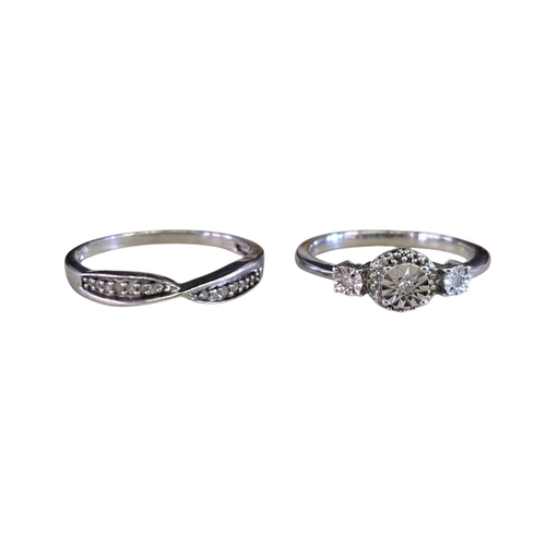 29 - A collection of 925 silver diamond-set ringscomprising four rings of various designs, including an i... 