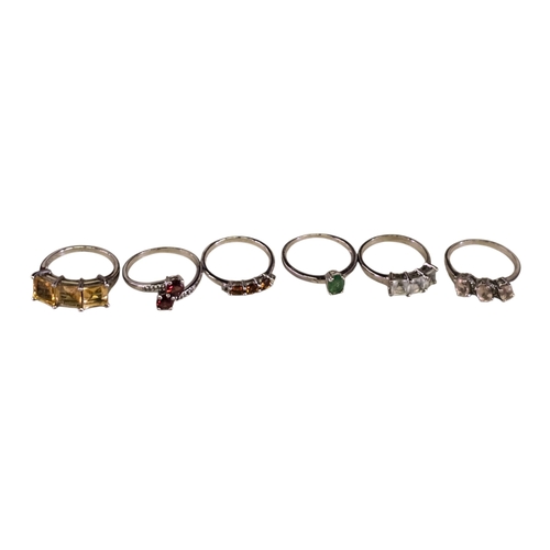30 - A collection of 925 silver gem-set rings,comprising a three-stone citrine ring, size R½; a two-stone... 
