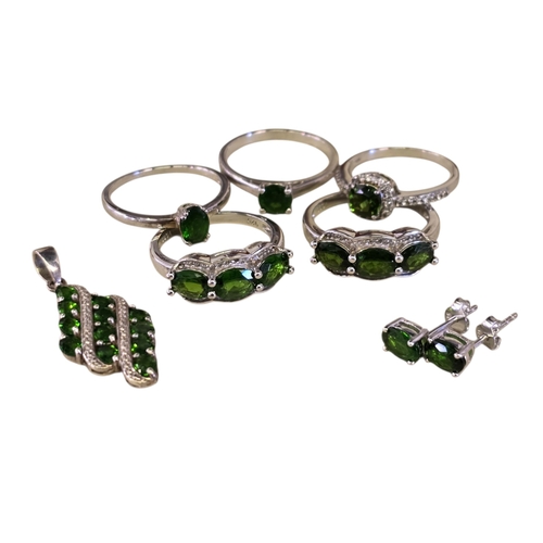 31 - A collection of sterling silver and chrome diopside jewellery, comprising two three-stone rings with... 