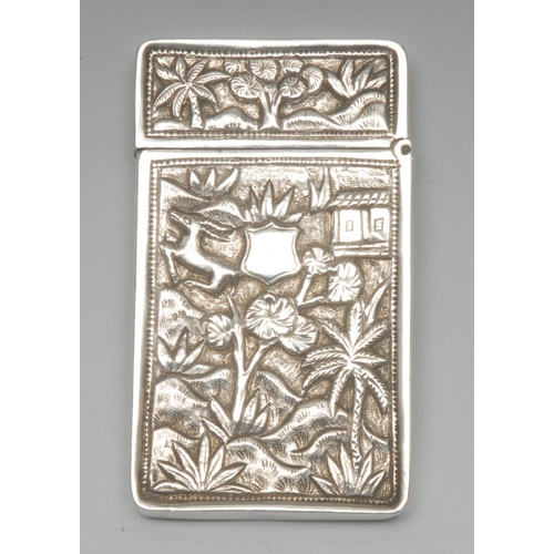 1000 - A Chinese silver rectangular visiting card case, chased with temples and deer amongst trees, hinged ... 