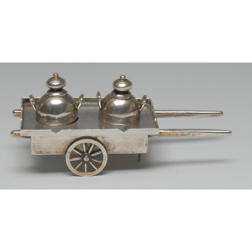 1004 - A Chinese silver novelty cruet, as a pair of churns on a handcart, 11.5cm long, character marks, ear... 