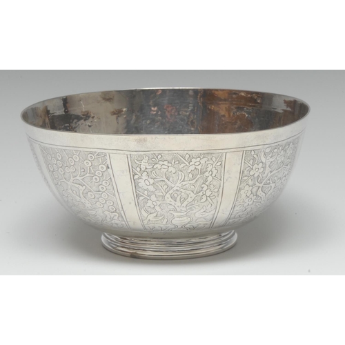 1006 - A Chinese silver bowl, engraved with panels of blossoming branches, birds and pagodas, 15.5cm diam, ... 