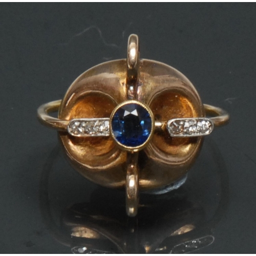 1119 - Rudolf Feldman, a contemporary modernist designed 14ct gold mounted sapphire and diamond swivel ring... 