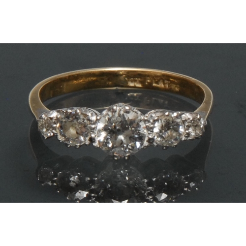 1120 - A quintet diamond ring, linear inset with five graduated old brilliant cut diamonds, largest central... 