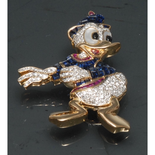 1123 - A Walt Disney Inspired Donald Duck diamond, ruby and sapphire encrusted brooch, 18ct yellow gold bod... 