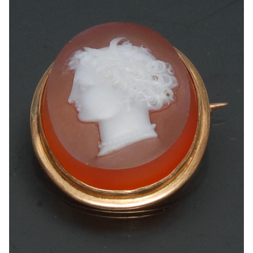 1129 - A 19th century carnelian hardstone cameo brooch, carved with a neoclassical  lady's head to dexter, ... 