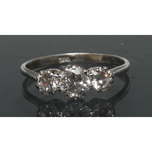 1136 - A diamond trilogy ring, central round brilliant cut diamond approx 0.60ct, flanker either side by a ... 