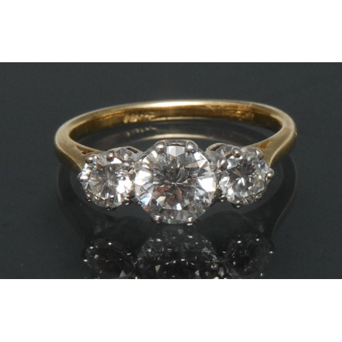 1137 - A diamond trilogy ring, central old brilliant cut diamond approx 1.03ct, flanked by a smaller confor... 