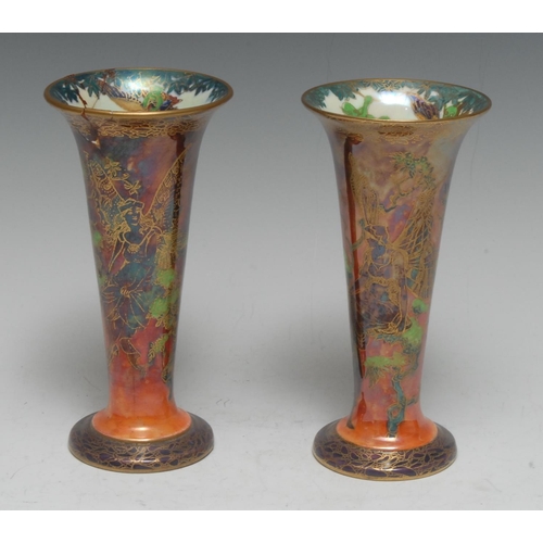 128 - A pair of Wedgwood Fairyland Lustre Butterfly Women pattern tall trumpet shaped vases, designed by D... 