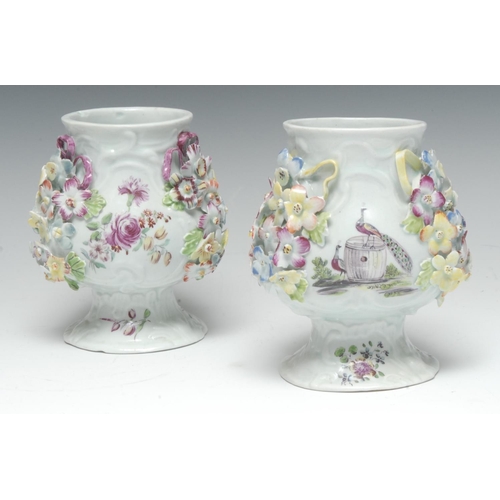 191 - A rare and early pair of Derby lobed triform globular vases, moulded in high relief with rocaille an... 