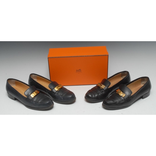 1957 - Luxury Fashion - a pair of Hermes lady's navy leather shoes, European size 13 1/2; another pair, bla... 