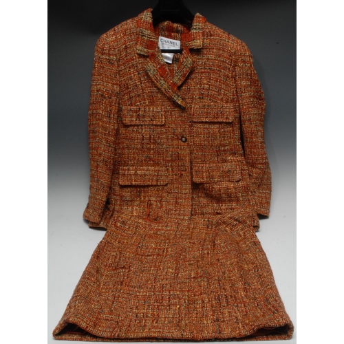 1957B - Luxury Fashion - a vintage Chanel two-piece lady's 'tweed' suit, comprising jacket and skirt, faux t... 