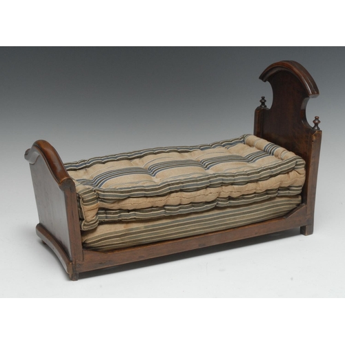 1962 - Miniature Furniture - a 19th century French Provincial walnut bed, of joined construction, the headb... 