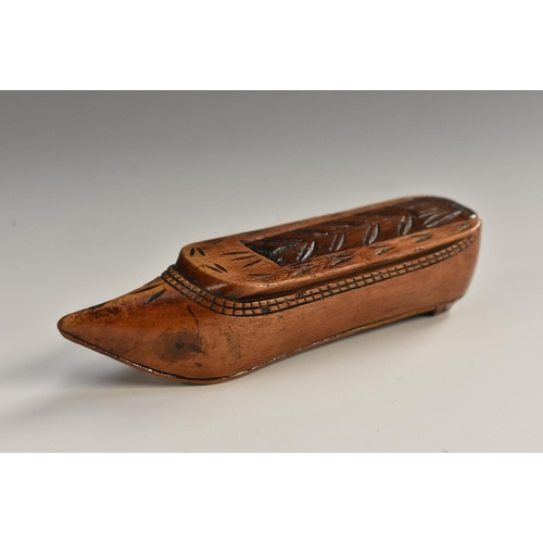 1988 - An early 19th century novelty snuff box, as a shoe, chip-carved sliding cover, 8.5cm long, c.1820