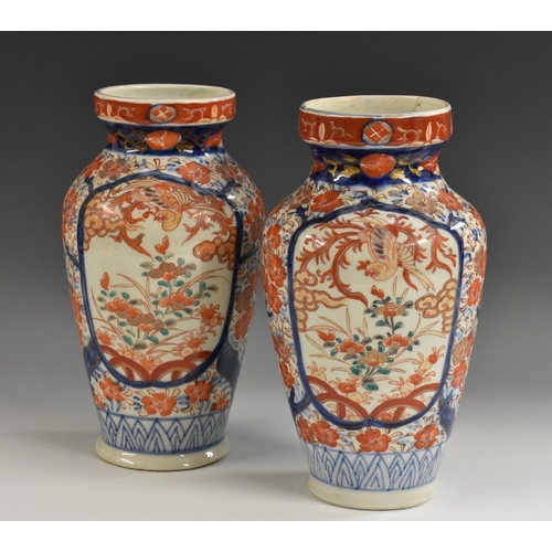 356 - A pair of late 19th century Japanese Imari chargers, decorated in the typical palette with vase with... 