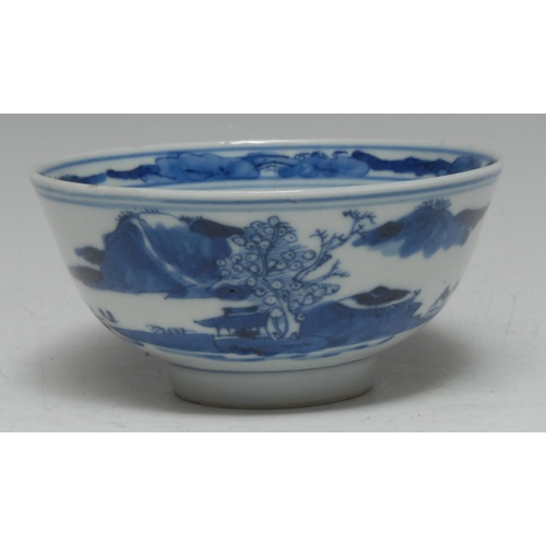 390 - A Chinese porcelain circular bowl, painted in underglaze blue with a stylized panoramic landscape, t... 