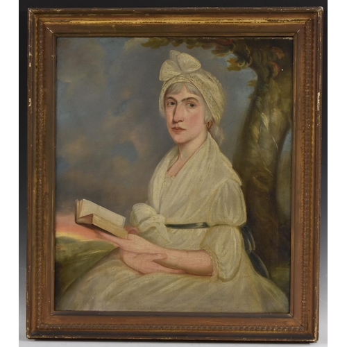 534 - English School (early 19th century) Portrait of a Lady with a Book oil on canvas, 74cm x 63cm  Label... 