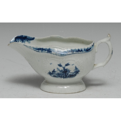 85 - A Worcester sauce boat, with slightly curved vertical moulding, painted with two slightly differing ... 