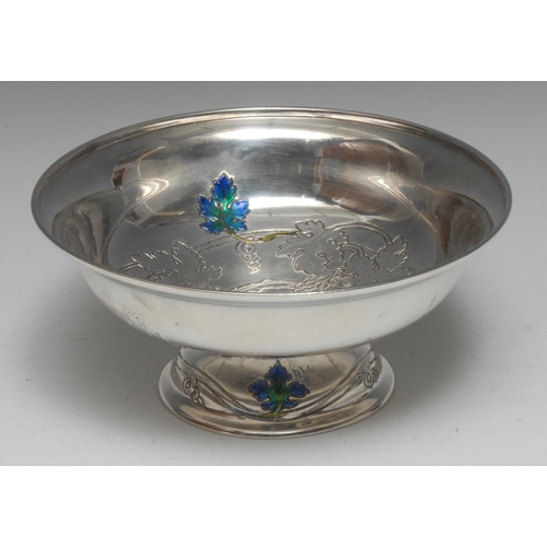 897 - Liberty & Co - an Arts and Crafts silver and enamel pedestal fruit bowl, chased with fruiting vine p... 