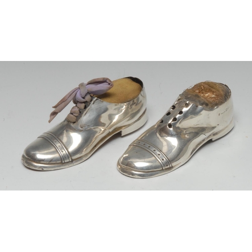 909 - A large Edwardian silver novelty pin cushion, as a shoe, 12.5cm long, Birmingham 1910; another, simi... 