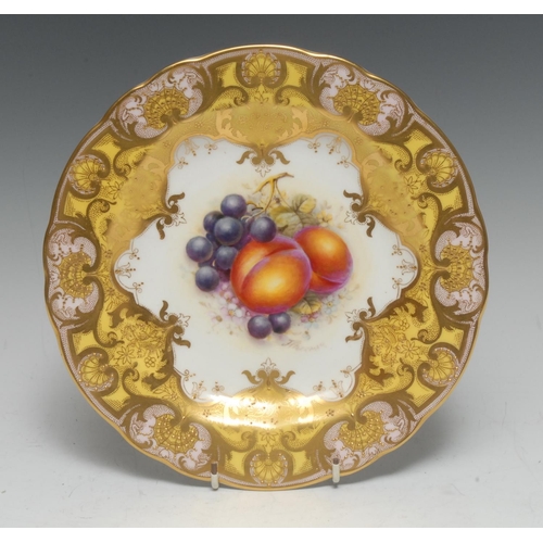 93 - A Royal Worcester shaped circular cabinet plate, painted by John Freeman, signed, with ripe peaches ... 