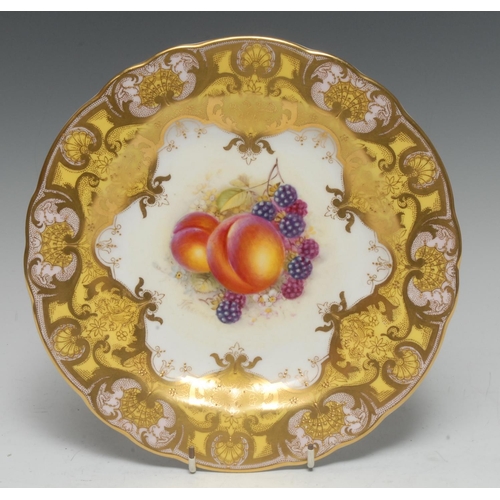 94 - A Royal Worcester shaped circular cabinet plate, painted by John Freeman, signed, with ripe peaches ... 