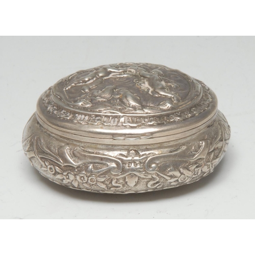 985 - A Dutch silver oval snuff box, hinged cover chased with putti, the side with flowers and scrolls, ha... 