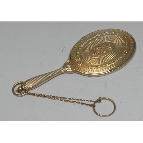 987 - A Continental silver-gilt lady's evening mirror, engine turned and chased with palm fronds, centred ... 