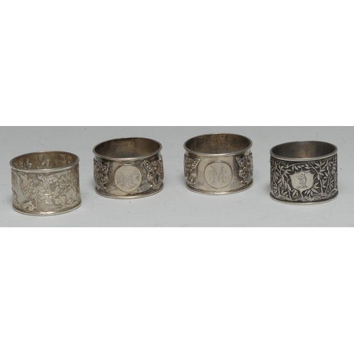 997 - A collection of Chinese silver napkin rings, various designs and makers (4)