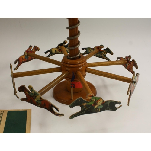 3024 - An early 20th century French parlour toy, the Grand Prix Merry Go Round Race Game, 42.5cm high, c.19... 